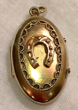 Load image into Gallery viewer, Locket, Antique Gold plated locket w 9kt gold horse shoe on front
