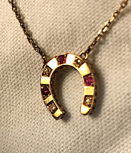 Necklace, 14 kt gold, antique diamond & ruby horse shoe