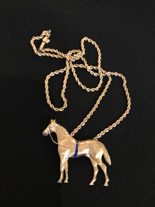 Necklace, 14 kt gold large horse pendant w a blue surcingle on woven 18” chain