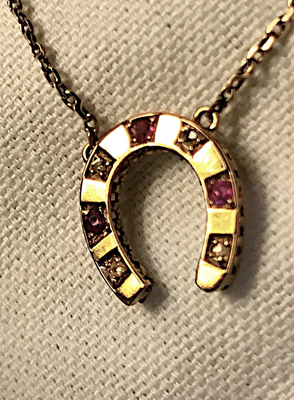 Necklace, 14 kt gold, antique diamond & ruby horse shoe